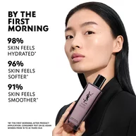 Wen, YSL Beauty model, with light skin, holding Pure Shots Youth Reload Essence-in-Lotion, highlighting hydration claims.