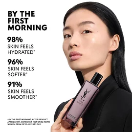 Wen, YSL Beauty model, with light skin, holding Pure Shots Youth Reload Essence-in-Lotion, highlighting hydration claims.