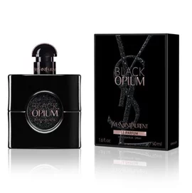 Le flacon Black Opium Le Parfum a cote de son coffret noir orne du Cassandre YSL rose.
