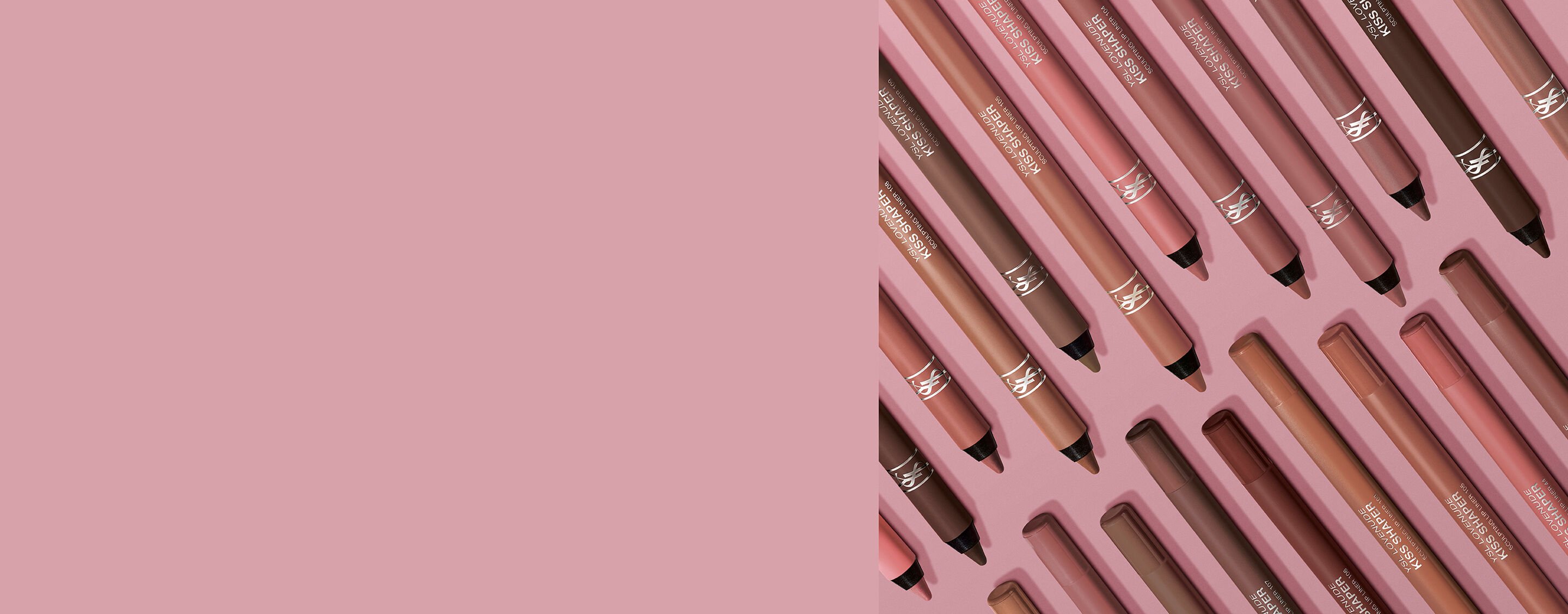 YSL LOVENUDE KISS SHAPER lip liners arranged in pale pink packaging pattern.